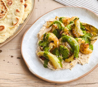 Baharat Roasted Cauliflower with butterbean hummus & coriander dressing
