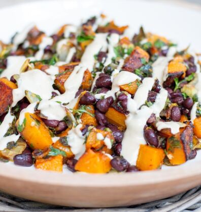 Vegan roasted squash with black beans and tahini