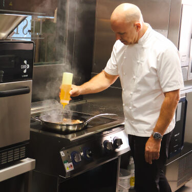 Chef Adam Gray cooking with Mellow yellow